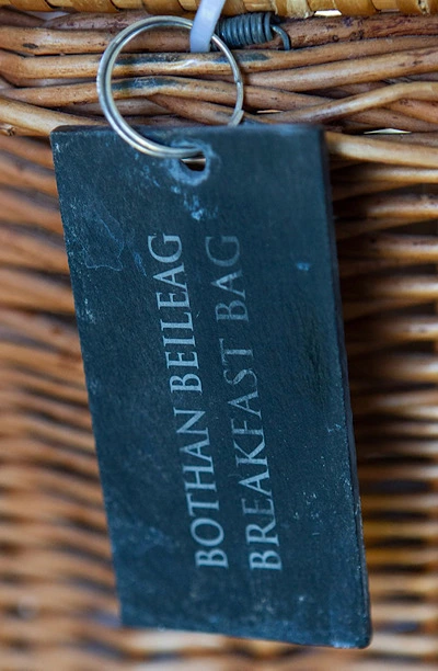 Wicker breakfast basket, with slate tag, with the name of a hut
